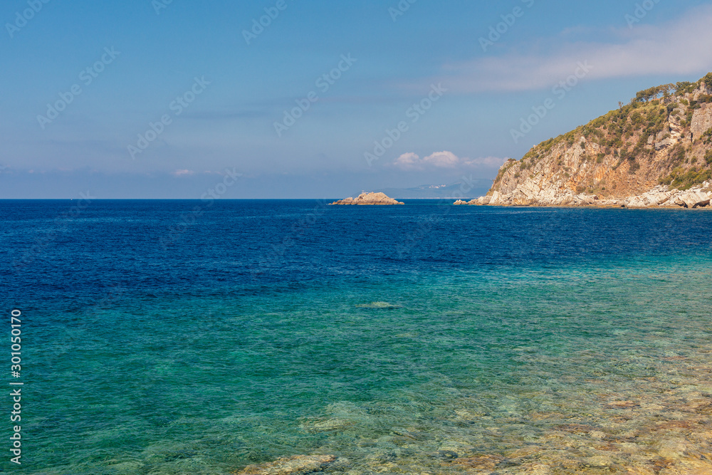 View of coastline rocks with clear turquoise water