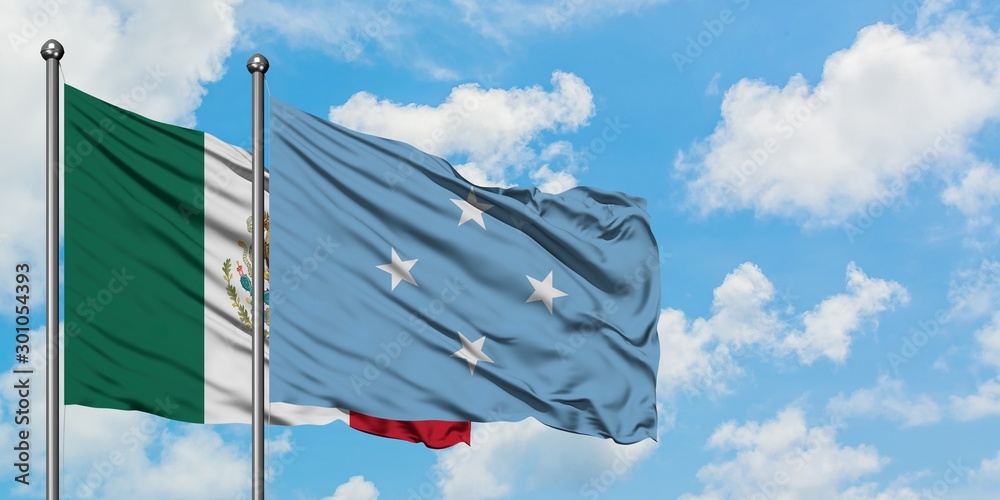 Mexico and Micronesia flag waving in the wind against white cloudy blue sky together. Diplomacy concept, international relations.