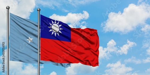 Micronesia and Taiwan flag waving in the wind against white cloudy blue sky together. Diplomacy concept, international relations.