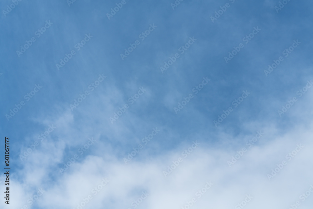 White cloud and blue sky background with copy space