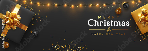 Christmas banner. Background Xmas design of sparkling lights garland, realistic gifts box, black balls and glitter gold confetti. Horizontal christmas poster, greeting cards, headers website