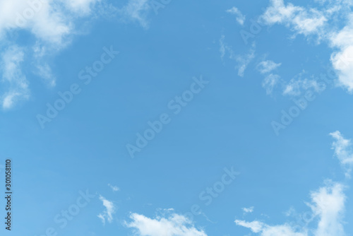 White cloud and blue sky background with copy space