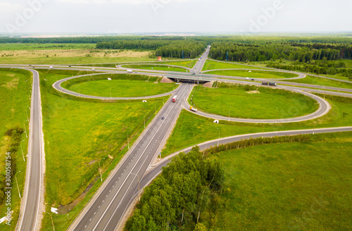 View above of a new highway road with road junction in Russia