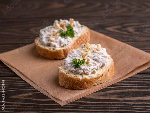Tasty sandwiches with healthy chicken paste chopped walnuts and parsley