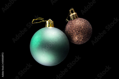 Duo of christmas balls, on black background