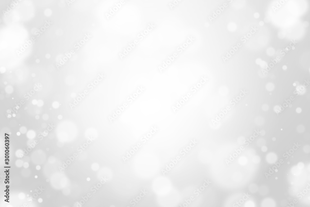 Bokeh abstract blurred silver and white beautiful background. Soft color light glitter sparkles. element for backdrop or design cosmetic ads, winter, christmas, luxury, beauty, baby