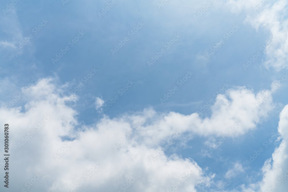 White cloud and blue sky background with copy space