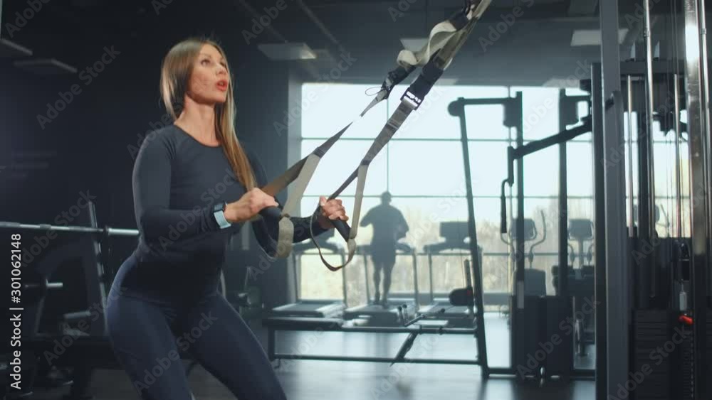 Young woman at the morning training in gym Young woman at the morning training in gym