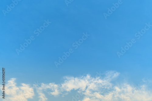 White cloud and blue sky background with copy space