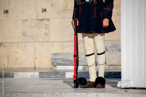 Close up of a  President's of Greece guard holding a rifle at the Syntagma square. photo