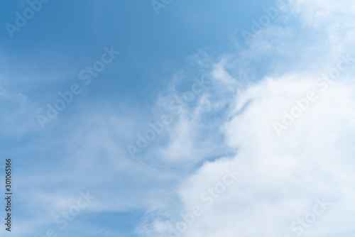 White cloud and blue sky background with copy space