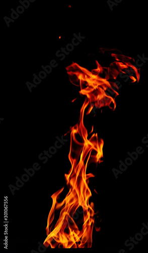 Fire flame isolated on black background. Vertical flare of fire. For action design. © Stepanov Aleksei