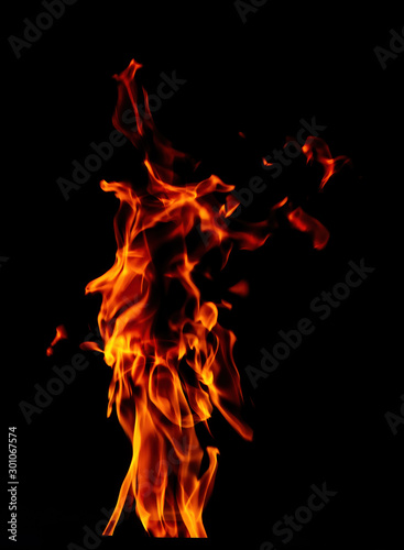 Fire flame isolated on black background. Beautiful yellow, orange and red blaze flashes of fire.