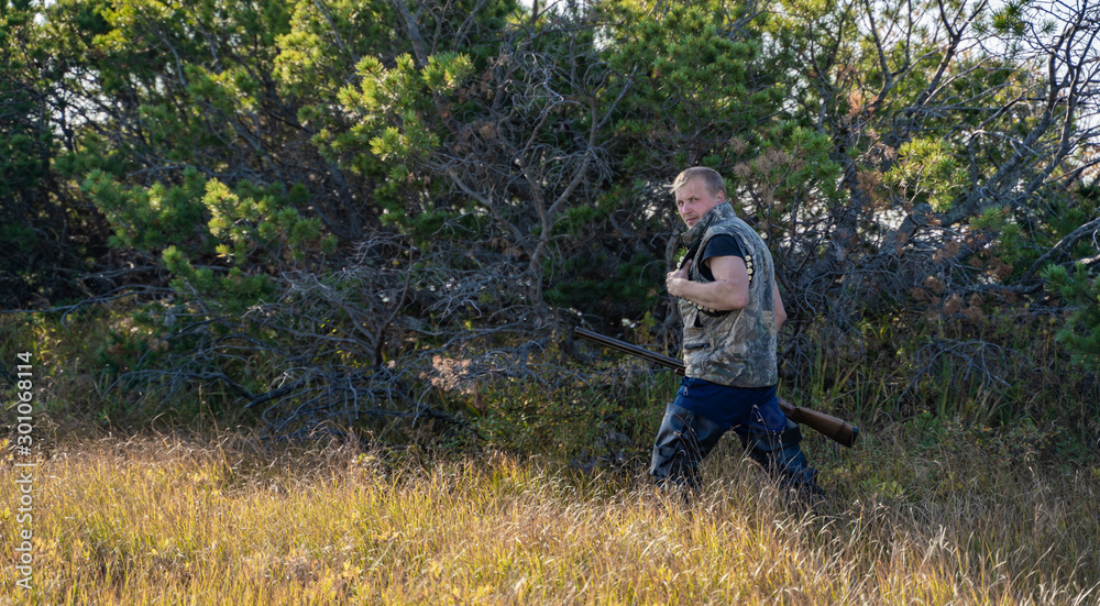 man with a gun goes in the forest man with a gun goes in the forest