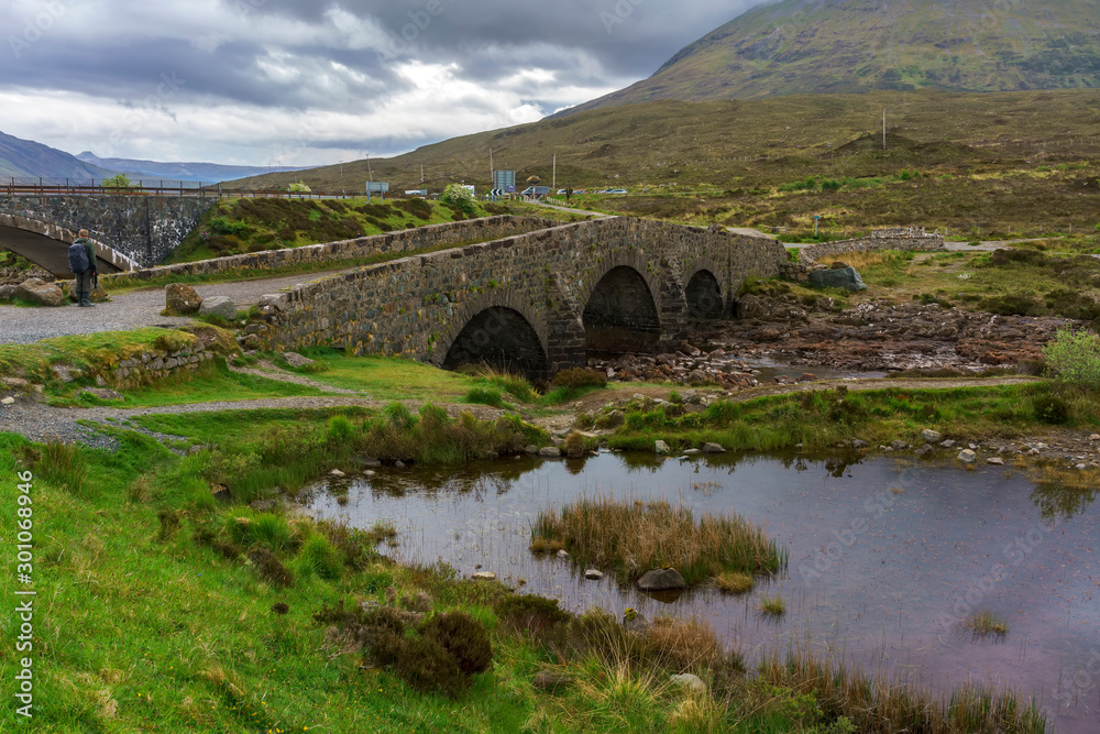 An old Sligachan bridge situated at the junction of the roads from Portree, Dunvegan and Broadford , provides a good viewpoint for seeing the Black Cuillin mountains ,  Isle of Skye, Scotland
