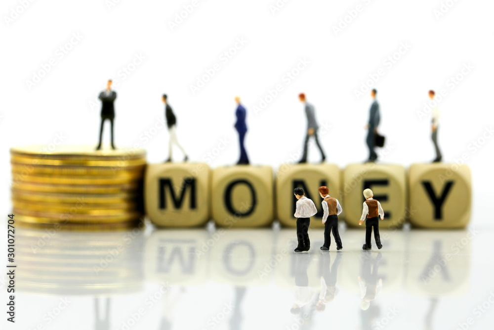Miniature people: businessman with wooden blocks stack of coins, Money, Financial, Business Growth concept. Miniature people: businessman with wooden blocks stack of coins, Money, Financial, Business Growth concept.