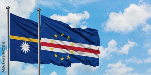 Nauru and Cape Verde flag waving in the wind against white cloudy blue sky together. Diplomacy concept, international relations.