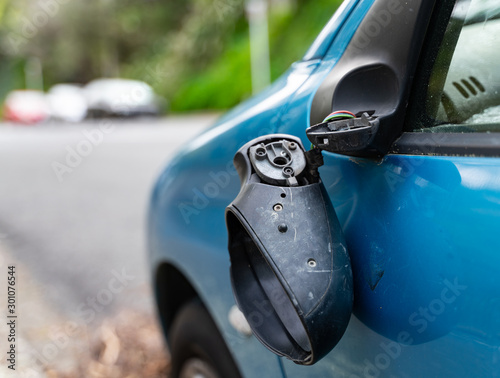 Vandalised/vandalized stolen car with smashed window and wing mirror - dumped on the road in Wellington, New Zealand