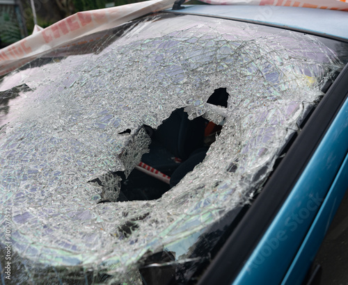 Vandalised stolen car with smashed window and wing mirror - dumped on the road in Wellington, New Zealand