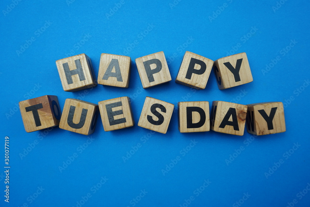 Happy Tuesday text alphabet letter on blue background Happy Tuesday text alphabet letter on blue background