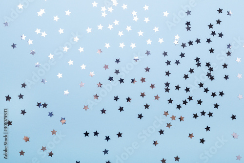 Sparkles on pastel blue background. Christmas, winter, new year concept. Flat lay, top view, copy space - Image