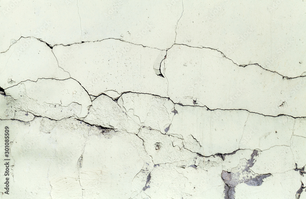 Old grungy concrete wall with cracks