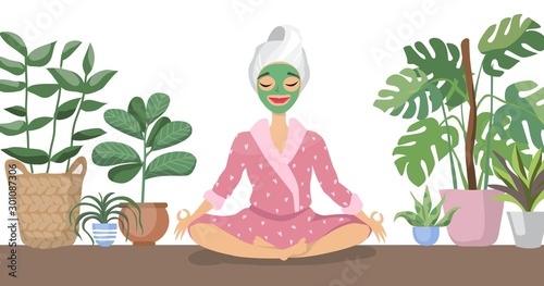 Beautiful young woman with facial mask on her face relax at home