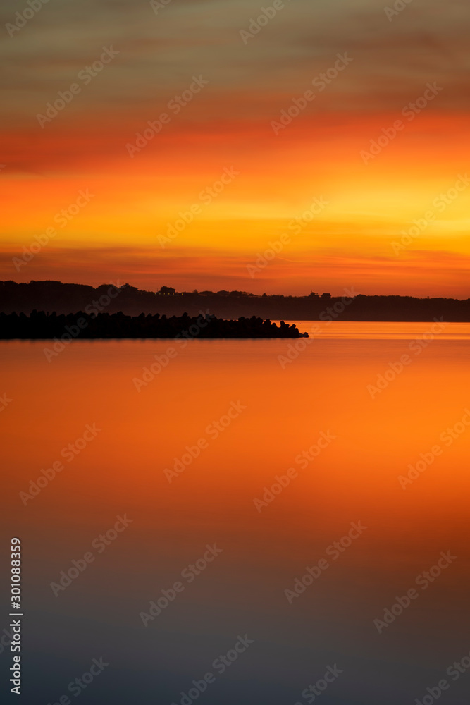 Beautiful orange sunrise at the sea