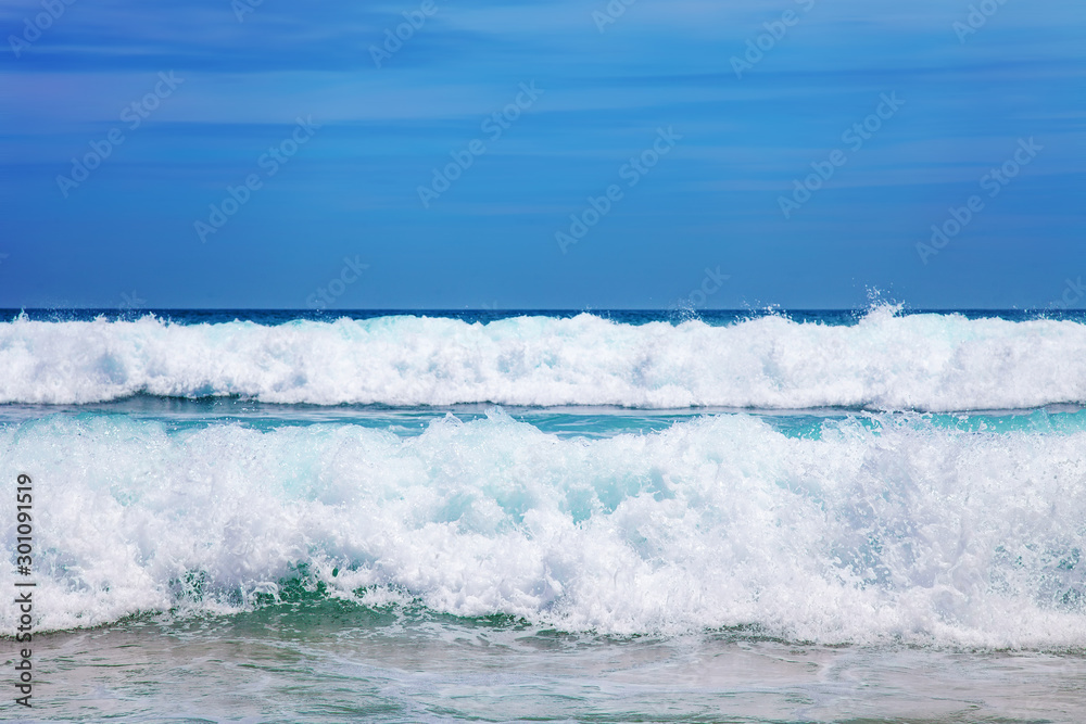 Blue Sea Wave with White Foam and Sky Blue Sea Wave with White Foam and Sky