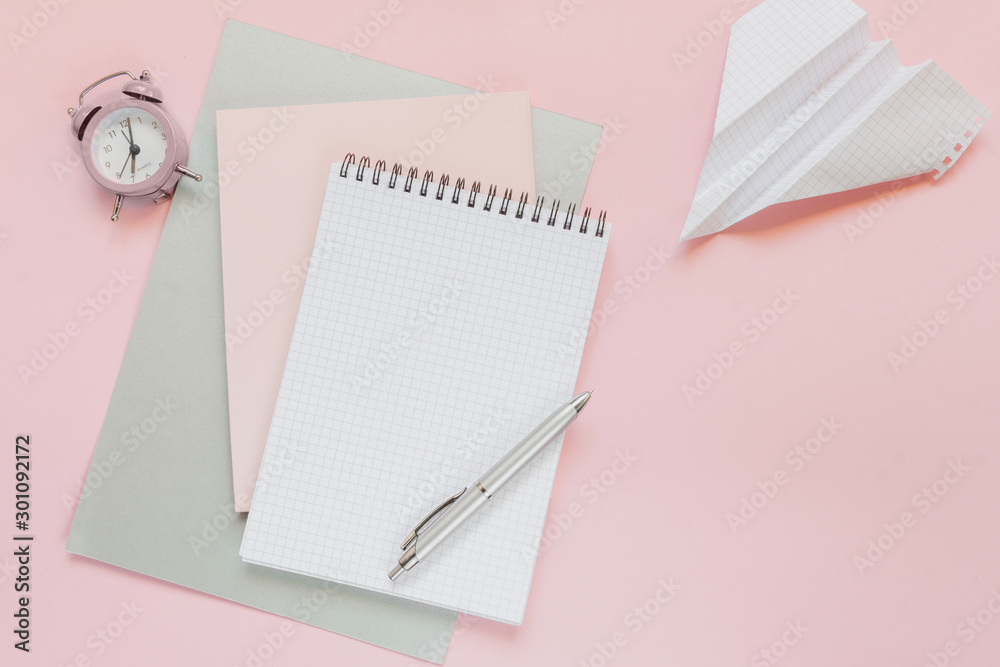 Blank notebook for writing on spirals on a pink background, flat lay, the end of motivation, business, building goals with negative industrial space and copy space Blank notebook for writing on spirals on a pink background, flat lay, the end of motivation, business, building goals with negative industrial space and copy space