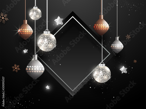 Illustration of hanging baubles with stars and snowflakes decorated on black background with empty frame given for your message.