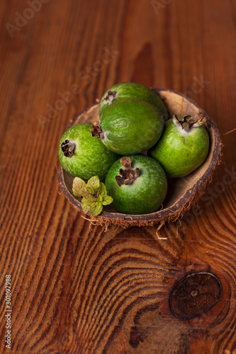 fruit in a basket on wooden table