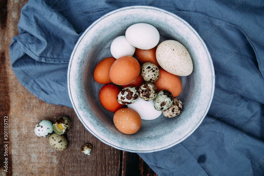 eggs in a bowl on wooden table eggs in a bowl on wooden table