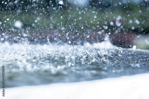 Obraz na plátne blue color tone of close up rain water drop falling to the floor in rainy season
