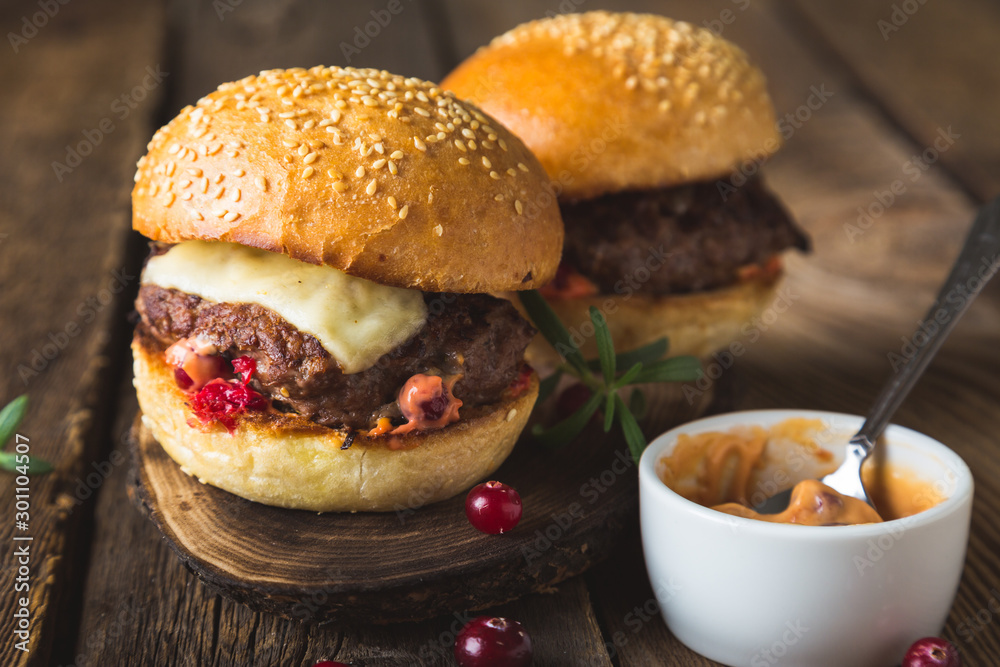 Big burger with cheese and cranberry sauce Big burger with cheese and cranberry sauce