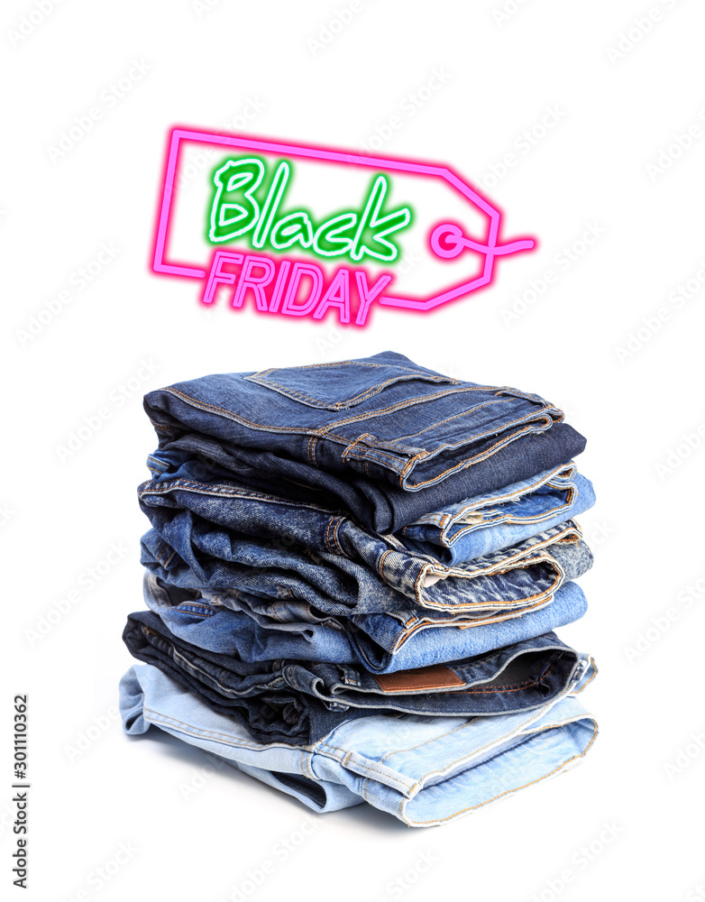 Stack of jeans pants on white background. Black friday sale - Image Stock  Photo | Adobe Stock
