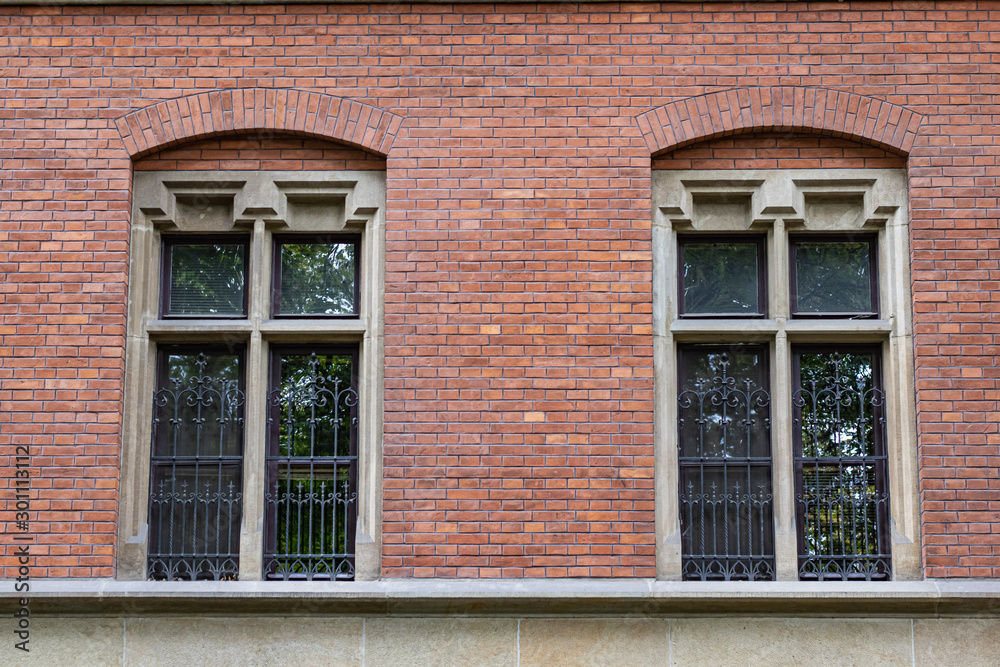 Two Windows on Brick Wall Background