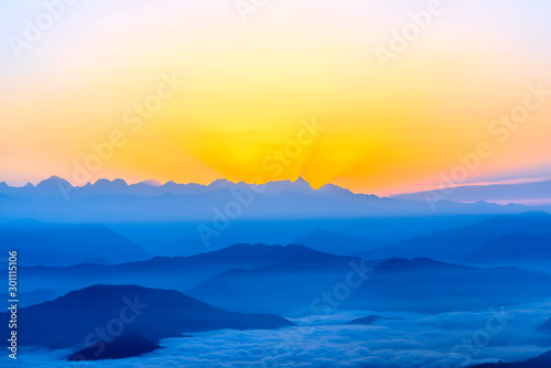 Sunrise over the mountains view from above © phototravelua