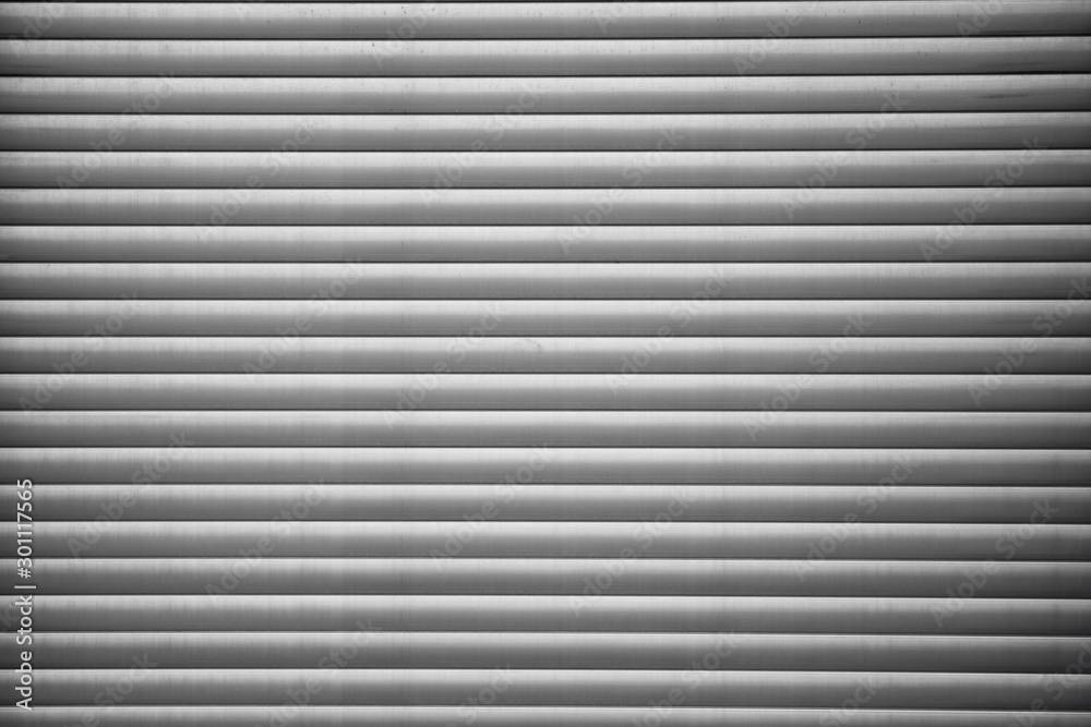 Automatic Factory Shutter Roller Door Indoor, Steel Rolling Gate Door for Security System of Warehouse Storage. Architecture Metal Access Doorway With Granite Wall Background of Workshop Garage. Automatic Factory Shutter Roller Door Indoor, Steel Rolling Gate Door for Security System of Warehouse Storage. Architecture Metal Access Doorway With Granite Wall Background of Workshop Garage.