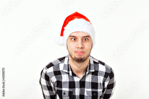 X-mas, winter holidays and people concept - funny man in santa claus hat over white background