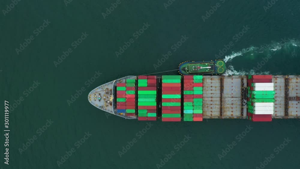 Aerial view of sea freight, Cargo ship, Cargo container in factory harbor at industrial estate for import export around in the world, Trade Port / Shipping - cargo to harbor Aerial view of sea freight, Cargo ship, Cargo container in factory harbor at industrial estate for import export around in the world, Trade Port / Shipping - cargo to harbor