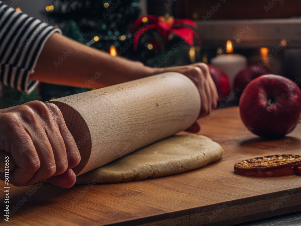 Roll out the cookies dough with a rolling pin. Home Pastry preparation on Christmas time. traditional Christmas cookies with cinnamon and spice 3