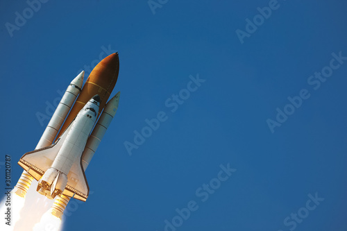 Rocket launch into dramatic sky. The elements of this image furnished by NASA.