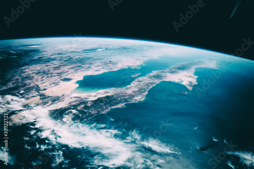 Fototapeta Naklejka Na Ścianę i Meble -  Blue earth, shot in distance. The elements of this image furnished by NASA.