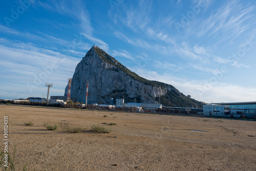 The Rock of Gibraltar overlooking the sea and beach