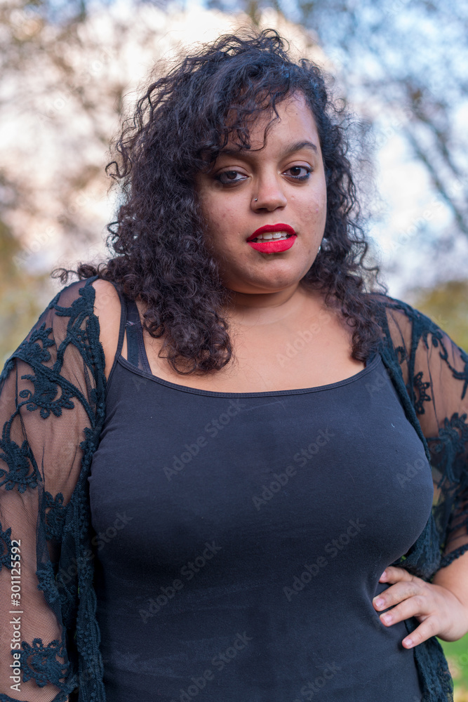 Portrait of woman with black curly hair and black eyes of Moroccan origin Portrait of woman with black curly hair and black eyes of Moroccan origin