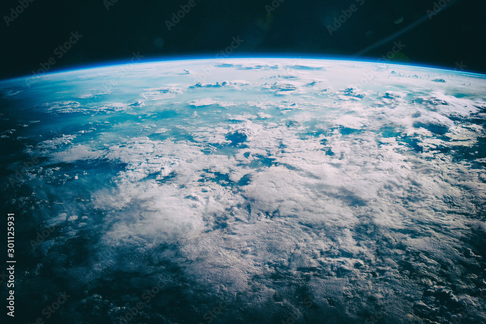 Fototapeta premium Earth, galaxy and stars. The elements of this image furnished b