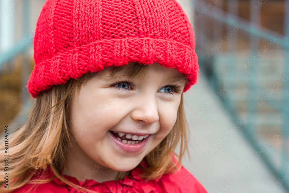 emotional portrait, face of a little girl in red clothes closeup laughing joyfully, happy childhood, space for text emotional portrait, face of a little girl in red clothes closeup laughing joyfully, happy childhood, space for text