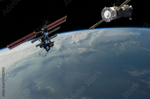 Space station. Different spaceships above the earth. The elements of this image furnished by NASA.