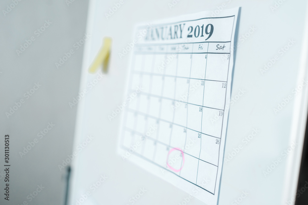 selective focus of calendar with january lettering on flipboard selective focus of calendar with january lettering on flipboard